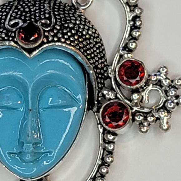 Sterling Silver Pendant with Blue Carved Face and Garnet Accents - Picture 11 of 12